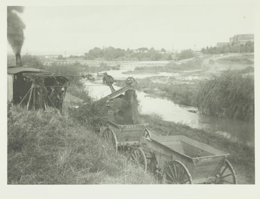 Digging sand by mechanised digger from the Molonglo River near the Power House (on the right).