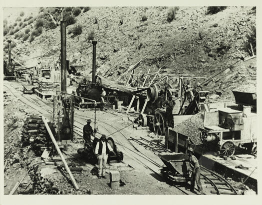 Cotter Dam construction showing various machines, tramlines and workers.