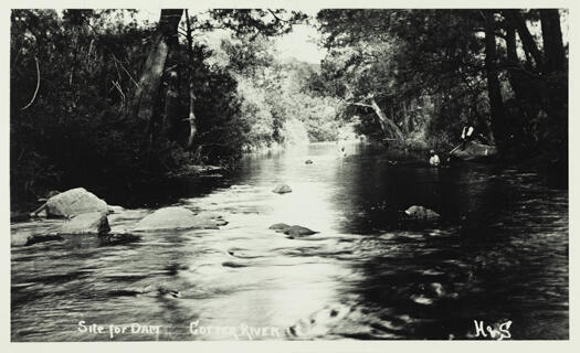 Site for the dam on the Cotter River. Photo shows two men swimming and one man fishing.