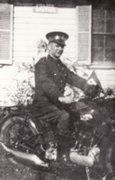 Ivan Charles, police motor cycle rider, outside the police station in Civic