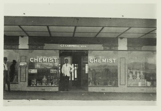 Campbell's Chemist in Giles Street, Kingston. The chemist is standing in the doorway.