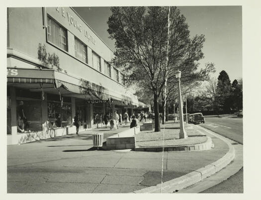 J.B. Young's on the corner of Giles Street and Jardine Street, Kingston. Shoppers are visible on the street.