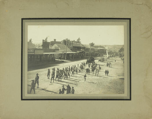 Sportmans recruiting day procession of soldiers and civilians through Queanbeyan (probably Monaro Street)