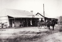 People standing on the verandah of the Cricketer's Arms Hotel, Hall.