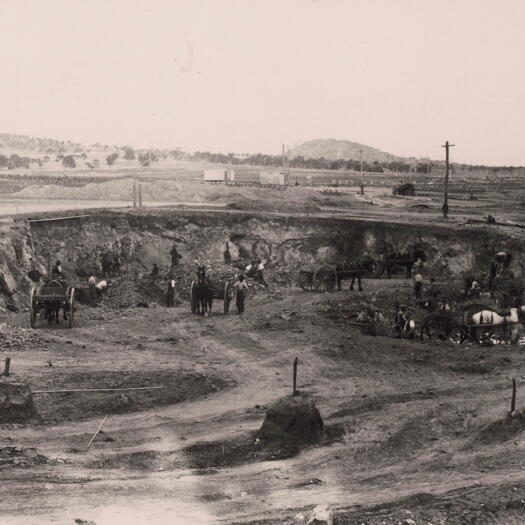 Horse and shovels doing excavation work for the Power House Reservoir. 