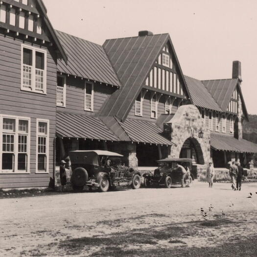 Hotel Kosciusko. Shows two vintage cars with people dressed in clothing circa 1920s-30s.