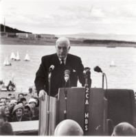 Sir Robert Menzies at Regatta Point for the opening of Lake Burley Griffin with Russell and boats in background.