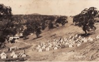 Cotter Camp showing numerous tents on the side of a hill.