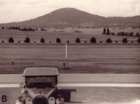 Australian War Memorial and Mt Ainslie from the steps of Parliament House.  Marker shows the site of the King George V memorial.