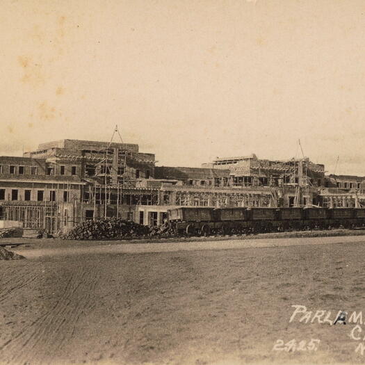 Parliament House under construction - rear with railway line and wagons