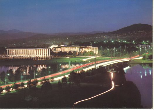 Commonwealth Avenue bridge and National Library at night.