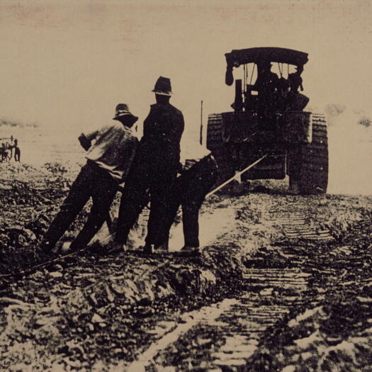 Tractor pulling shovel - road construction