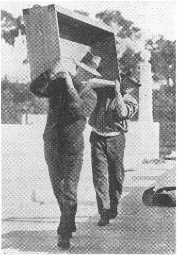 Parliament House - two workmen carrying a wooden box