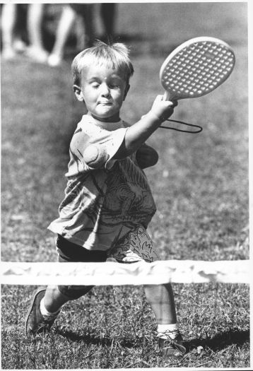 Alexander Tait, aged three has a go at tennis