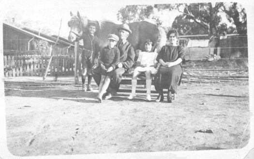 McCullough family in the back yard, 8 Westlake