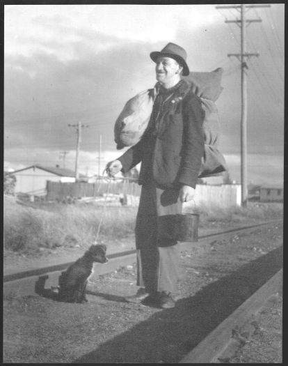 Why Worry (real name Isaac Wilson) - a swaggie with a dog at Kingston near the railway station. The image was taken circa 1930 during the Great Depression.