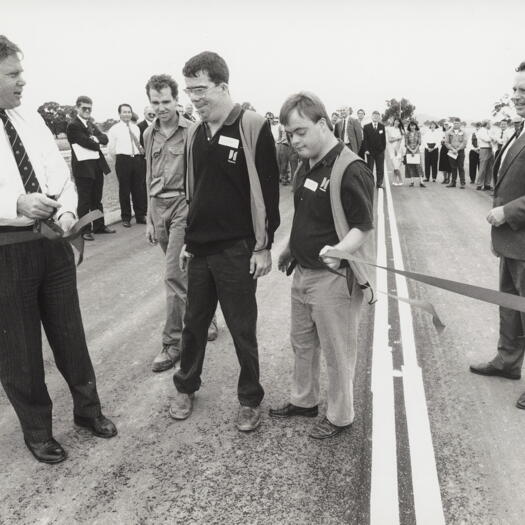 Bill Wood cuts ribbon