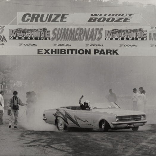 Summernats at Exhibition Park - burn out contestant gees up crowd