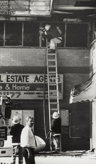 Fire damaged buildings at Weston shopping centre