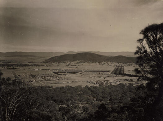 Haig Park in its early development stage, showing Northbourne Avenue and Mt. Ainslie in the background.