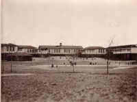 A front view Telopea Park School showing children at play.