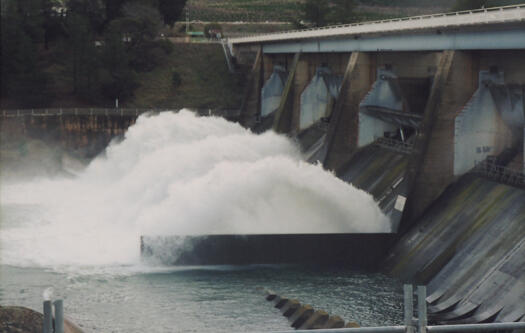 The flood gates of the Cotter Dam are open.