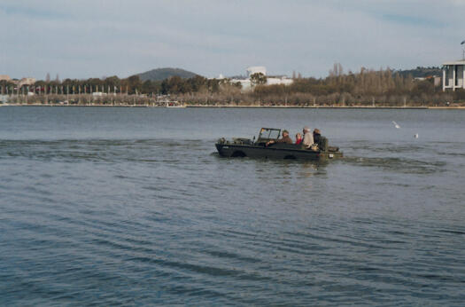 A group of people in a Ducky riding around Lake Burley Griffin.