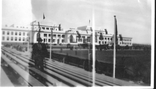 Shows some of the seats being filled with spectators.