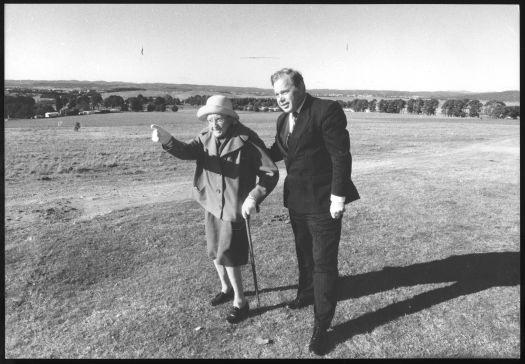Sylvia Curley and Bill Woods, Minister for Arts and Heritage, survey the 17 Hectare property Mugga Mugga near Red Hill.