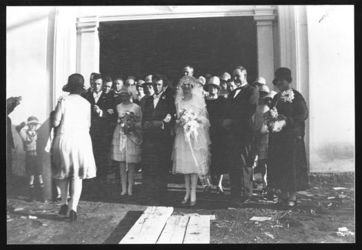 Shows a group photo at the wedding reception for Jack and Agnes Benson (nee Prowse) at the Blue Moon Cafe in Civic.