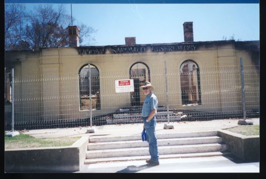 Robert Digan standing in front of Mt Stromlo Observatory



   

