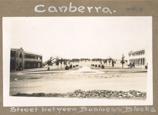 Looking towards City Hill with Sydney and Melbourne Buildings shown on either side of Northbourne Avenue