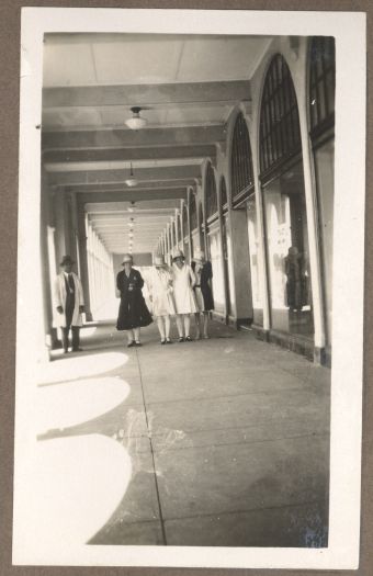 Four women standing outside a shop in either the Sydney or Melbourne Building