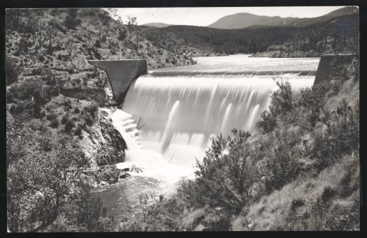 Cotter Dam with water pouring over the spillway