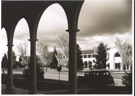 The Melbourne Building on the Northbourne Avenue side looking towards the Sydney Building. A car is parked on Northbourne Avenue