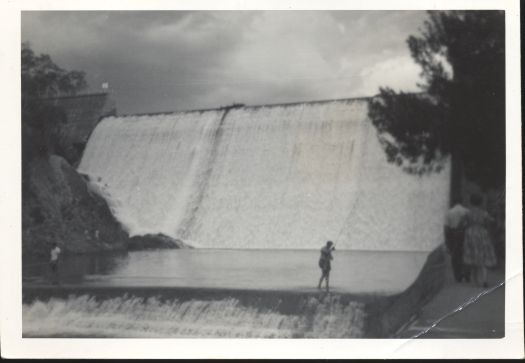 Cotter Dam with water pouring over the spillway