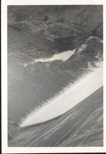 Looking down at the Cotter Dam and the water over the spillway