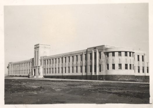 The photo shows the front of Canberra High School from Childers Street