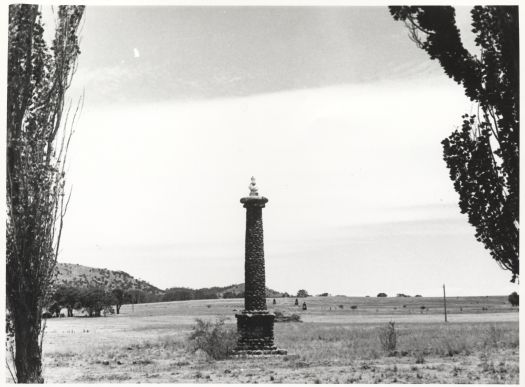 A rock pillar at Environa with a bust of Henry Parkes on top