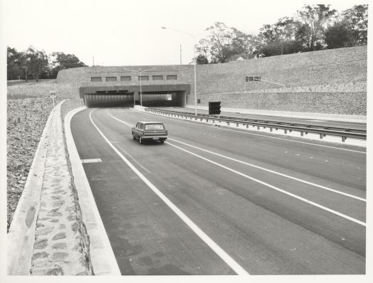 A car westwards bound on Parkes Way about to enter Acton Tunnel
