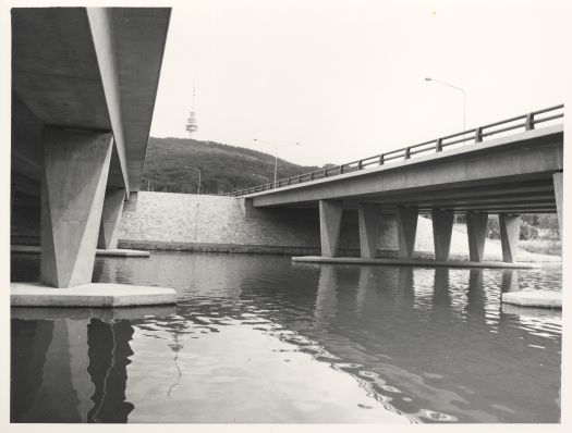 Sight of Black Mountain Tower from between Parkes Way Bridge spans over Sullivans Creek.