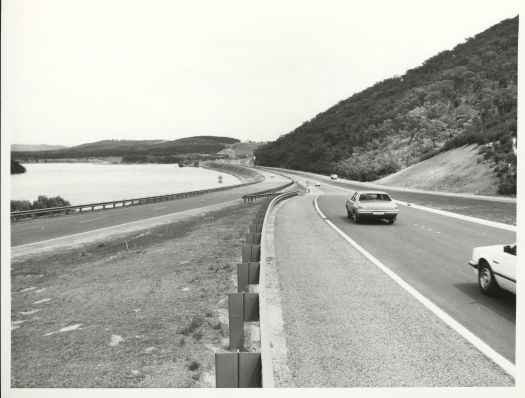 Traffic on Parkes Way looking west below Black Mountain, Lady Denman Drive and Lake Burley Griffin on left side.