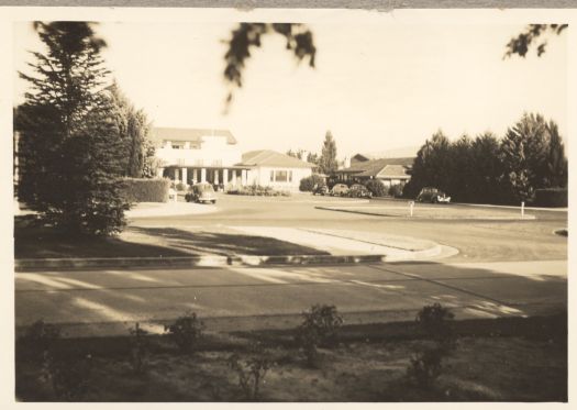 A distant view of the front of the Hotel Canberra in Commonwealth Avenue