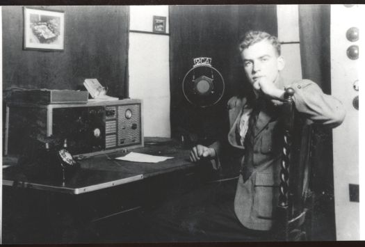 George Barlin at 17 years old taken mid 1933 at the 2CA microphone in the studio behind A.J. Ryan's Radio and Electrical Store, Giles Street, Kingston.