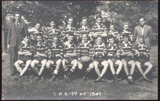 First XV rugby team, with two teachers
