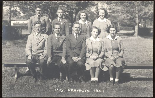 A photograph of six perfects and three teachers