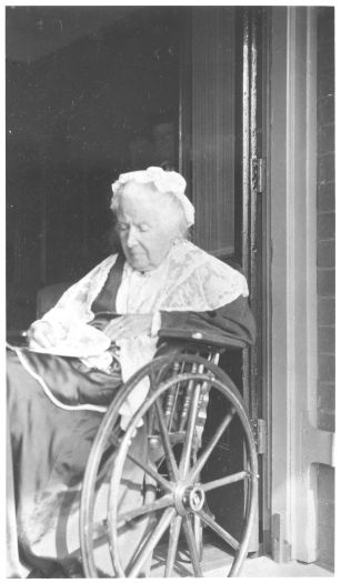 An elderly Mary Garran, sitting in a wheelchair.