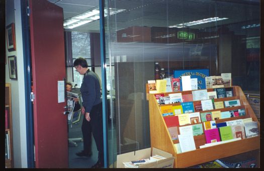 Administrator of the CDHS Helen Digan at the Society's premises at the Canberra Museum & Gallery in Civic talking to president, John Farquharson