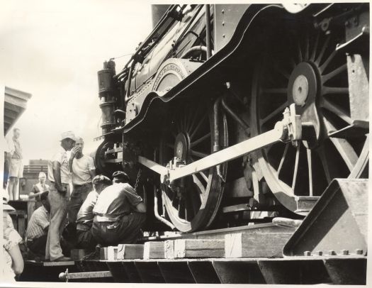 Railway engine 1210 being loaded on lorry for removal to the siding near the Canberra Railway Station