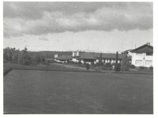 A front view of the Hotel Canberra and croquet lawn from Commonwealth Avenue